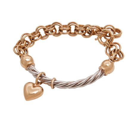 Fashionable golden bracelet with heart shape pendant from yellow and white gold isolated on white backgroundの写真素材