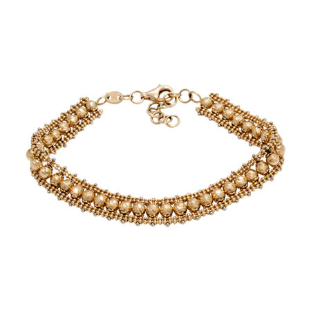 Graceful very special golden bracelet isolated on white backgroundの写真素材