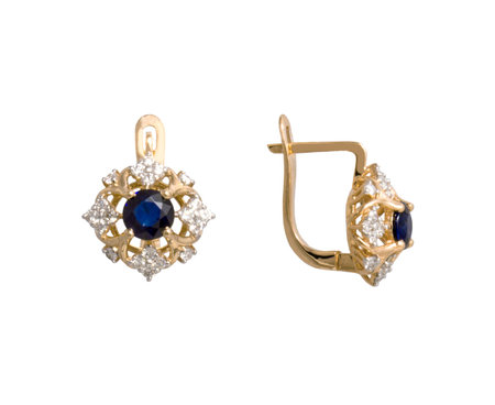 Golden earrings with dark blue gem - sapphire and few diamonds isolated on white backgroundの写真素材