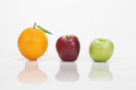Orange, apple and a pear isolated in white background