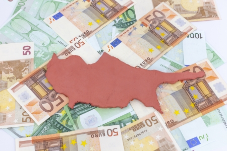 Cyprus standing  on euro money (Concept Cyprus financial crisis)の写真素材