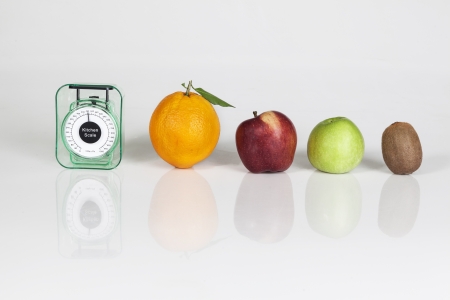 Fruits an weight scale isolated on white background の写真素材