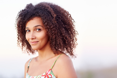 Closeup of a beautiful young woman outdoorsの写真素材