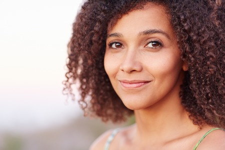 Closeup of a beautiful young woman outdoorsの写真素材
