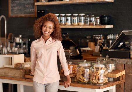 Portrait of an attractive young woman working in a cafeの写真素材