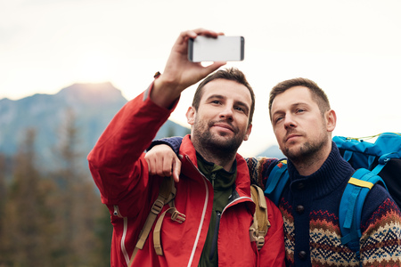 Hikers taking a selfie in the wildernessの写真素材