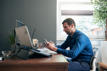 Entrepreneur using a digital tablet for business in an officeの写真素材