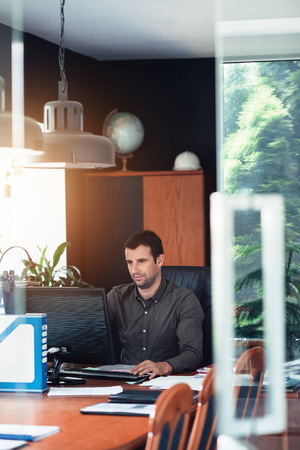 Focused businessman at work on a computer in an office