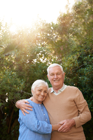 Smiling senior couple content together outsideの写真素材