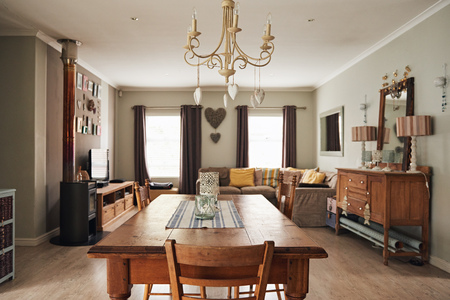 Dining table and living room in a suburban homeの写真素材