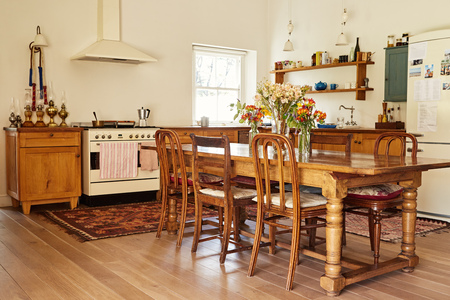 Dining area and kitchen in a country style homeの写真素材