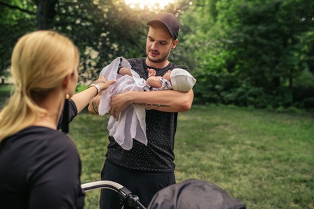 Young parents enjoying a day outside with their baby boyの写真素材
