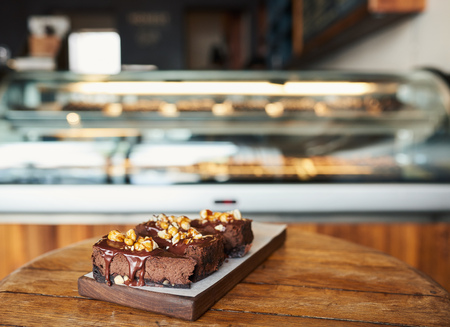 Slices of yummy chocolate cake sitting on a bakery tableの写真素材