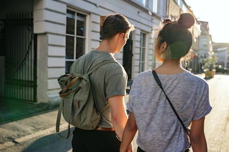 Young couple exploring the city together on footの写真素材