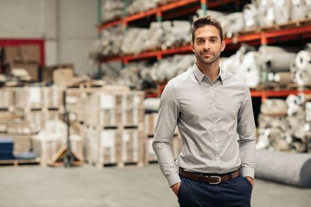 Warehouse manager standing on the floor of his warehouseの写真素材
