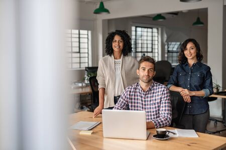 Diverse group of smiling designers working together in an officeの写真素材