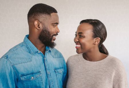 Young African American couple laughing together at homeの写真素材
