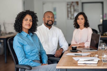 Diverse businesspeople working together at an office tableの写真素材