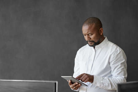 African American businessman using a tablet in an officeの写真素材