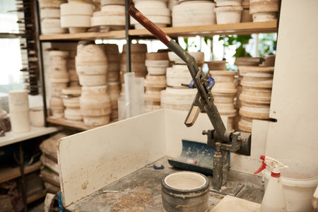 Mold sitting on a bench in a large pottery manufacturing workshopの写真素材