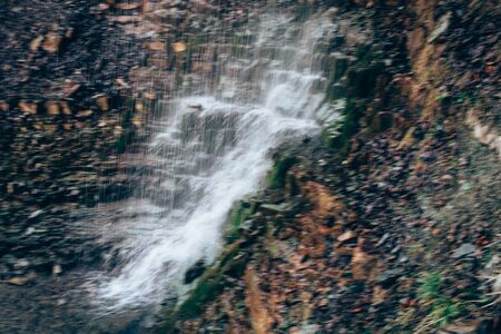 Long expose waterfall. Beautiful texture of rocks on background.