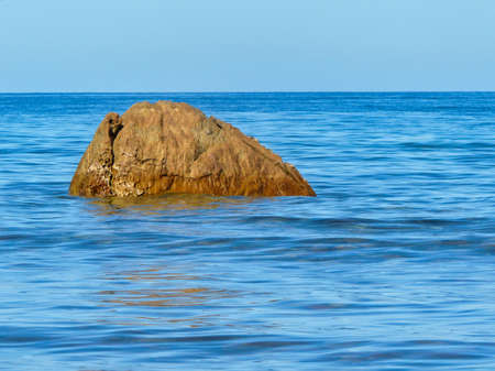 Ocean view - blue water and brown rockの写真素材