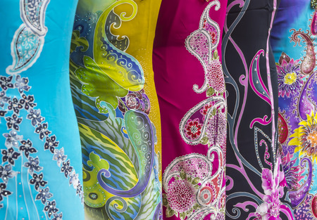 Mass produced colored textile in a traditional east market in Malaysiaの写真素材