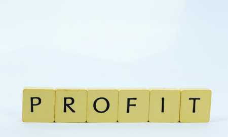 Yellow profit cube with white backgroundの写真素材