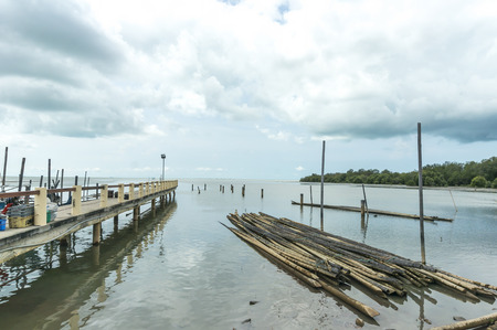 Jetty with grey cloudy skiesの写真素材