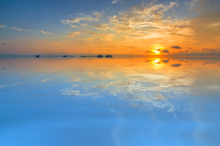 Beach with sunrise backgroundの写真素材