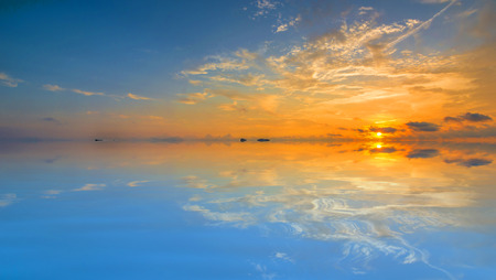 Beach with sunrise backgroundの写真素材