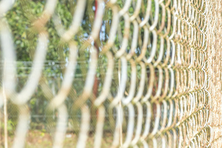 Iron chain fence with blurred foregroundの写真素材