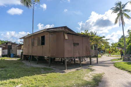 MABUL ISLAND, MALAYSIA - AUGUST 16, 2016 : View of poor wooden house and villagers at Mabul Island, Malaysia.のeditorial素材