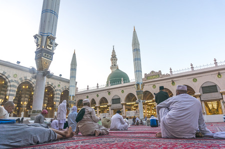 MEDINA, SAUDI ARABIA - MARCH 09, 2015 : Pigrims rest and reading Koran after fajr pray inside Nabawi...