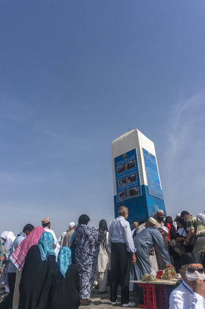 MECCA, SAUDI ARABIA - MAR 11: Muslims at Mount Arafat (or Jabal Rahmah) March 11, 2015 in Arafat, Saudi Arabia. This is the place where Adam and Eve met after being overthrown from heaven.のeditorial素材