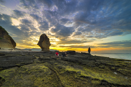 Sunrise at Batu Payung (Umbrella Rock) at Lombok, Indonesiaの写真素材