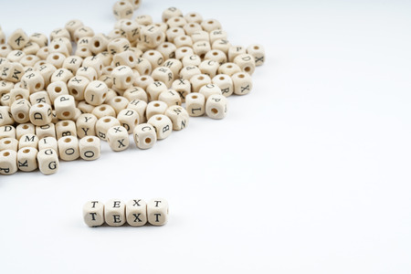 Wooden letter cube with white backgroundの写真素材