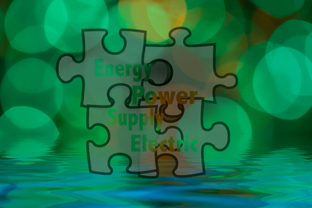 Jigsaw shape and conceptual text with bokeh blur background.の写真素材