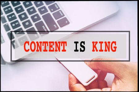 Hand and text CONTENT IS KING with vintage background. Technology concept.のeditorial素材