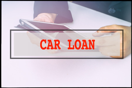 Hand and text  CAR LOAN with vintage background. Technology concept.の写真素材