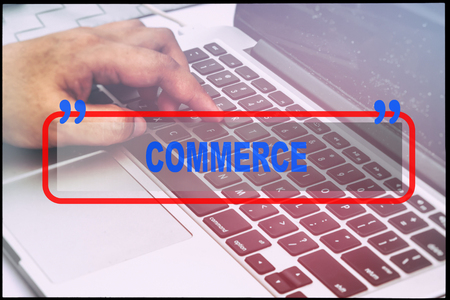 Hand and text  "COMMERCE" with vintage background. Technology concept.の写真素材