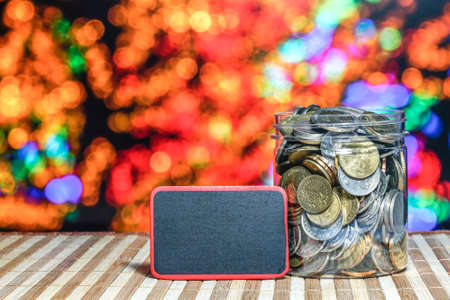 Coins in jar with led light background