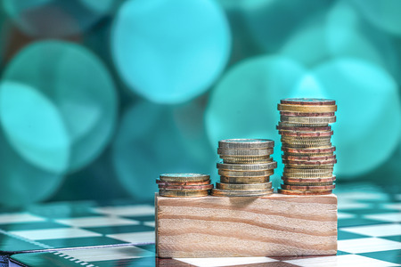 Coins with light bokeh backgroundの写真素材
