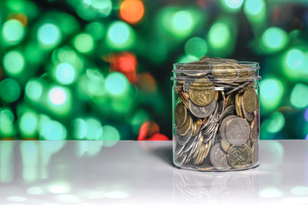 Coins with light bokeh backgroundの写真素材