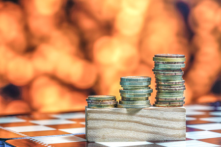 Coins with light bokeh backgroundの写真素材