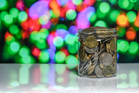 Coins with light bokeh backgroundの写真素材
