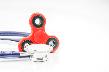 Fidget spinner and stethoscope with close up view.の写真素材