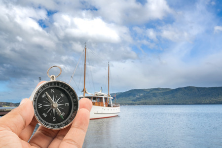 Ship park at wooden jetty with mountain background at Te Anau, New Zealand