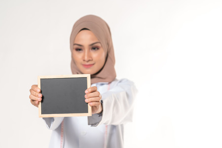 Hijab medical doctor with blackboard. Educational concept.の写真素材