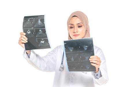 Hijab medical doctor looking at x-ray pictureの写真素材